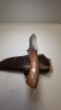 A fixed blade would handle D2 steel or 440C. Steel