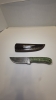 Damascus blade with a wood handle