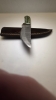Damascus blade with a wood handle