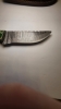 Damascus blade with a wood handle