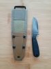 ESEE Izula black oxide finish with included G10 handle scales and MOLLE back