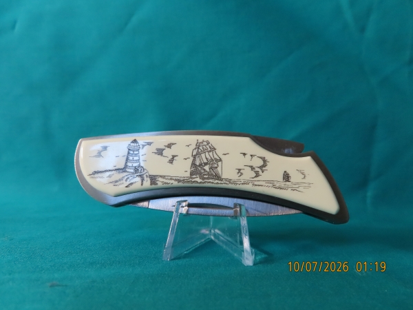 ZIPPO KNIFE, 'SCRIMSHAW SERIE'S, LIGHTHOUSE / SAILING SHIP