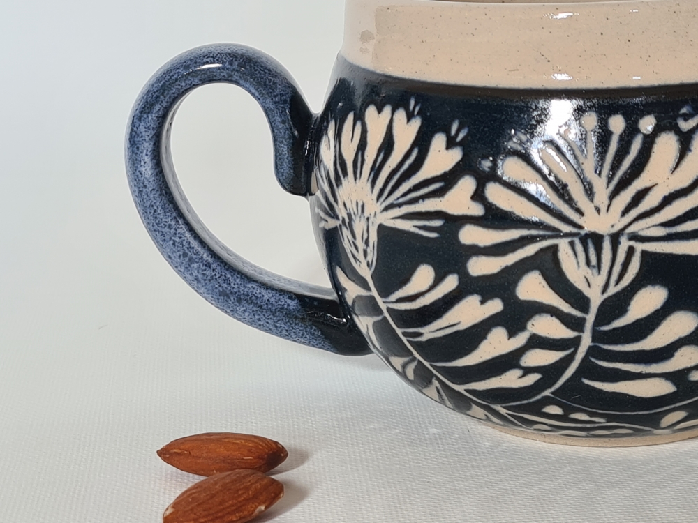 Floral sgraffito mug