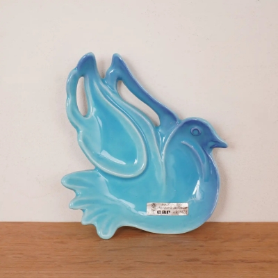 Vide poche représentant un oiseau stylisé bleu aqua de Car Firenze Années 70