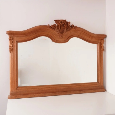 Miroir biseauté en bois sculpté
