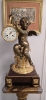 Reloj de sobremesa en bronce dorado y patinado, base de mármol, París, segunda mitad del siglo XIX