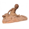 Léon Dufrène, escultura “Putto sobre piel de león” en terracota, circa 1900, Francia
