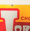 Chapa esmaltada de doble cara de Chocolates Torras, 1950 - 1959