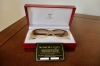 Gafas Cartier modelo Malmaison en madera de palisandro y metal dorado, con estuche y tarjeta de garantía, Francia, finales del siglo XX