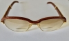 Gafas Cartier modelo Malmaison en madera de palisandro y metal dorado, con estuche y tarjeta de garantía, Francia, finales del siglo XX