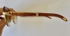 Gafas Cartier modelo Malmaison en madera de palisandro y metal dorado, con estuche y tarjeta de garantía, Francia, finales del siglo XX