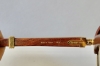 Gafas Cartier modelo Malmaison en madera de palisandro y metal dorado, con estuche y tarjeta de garantía, Francia, finales del siglo XX