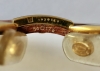 Gafas Cartier modelo Malmaison en madera de palisandro y metal dorado, con estuche y tarjeta de garantía, Francia, finales del siglo XX