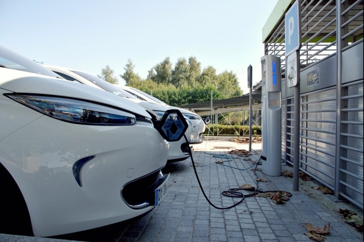 Electric cars plugged in at a charging station