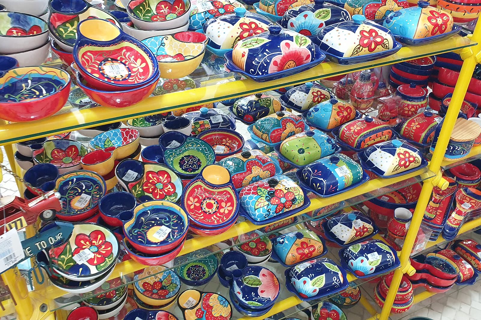 Hand-painted pottery on a shop shelf
